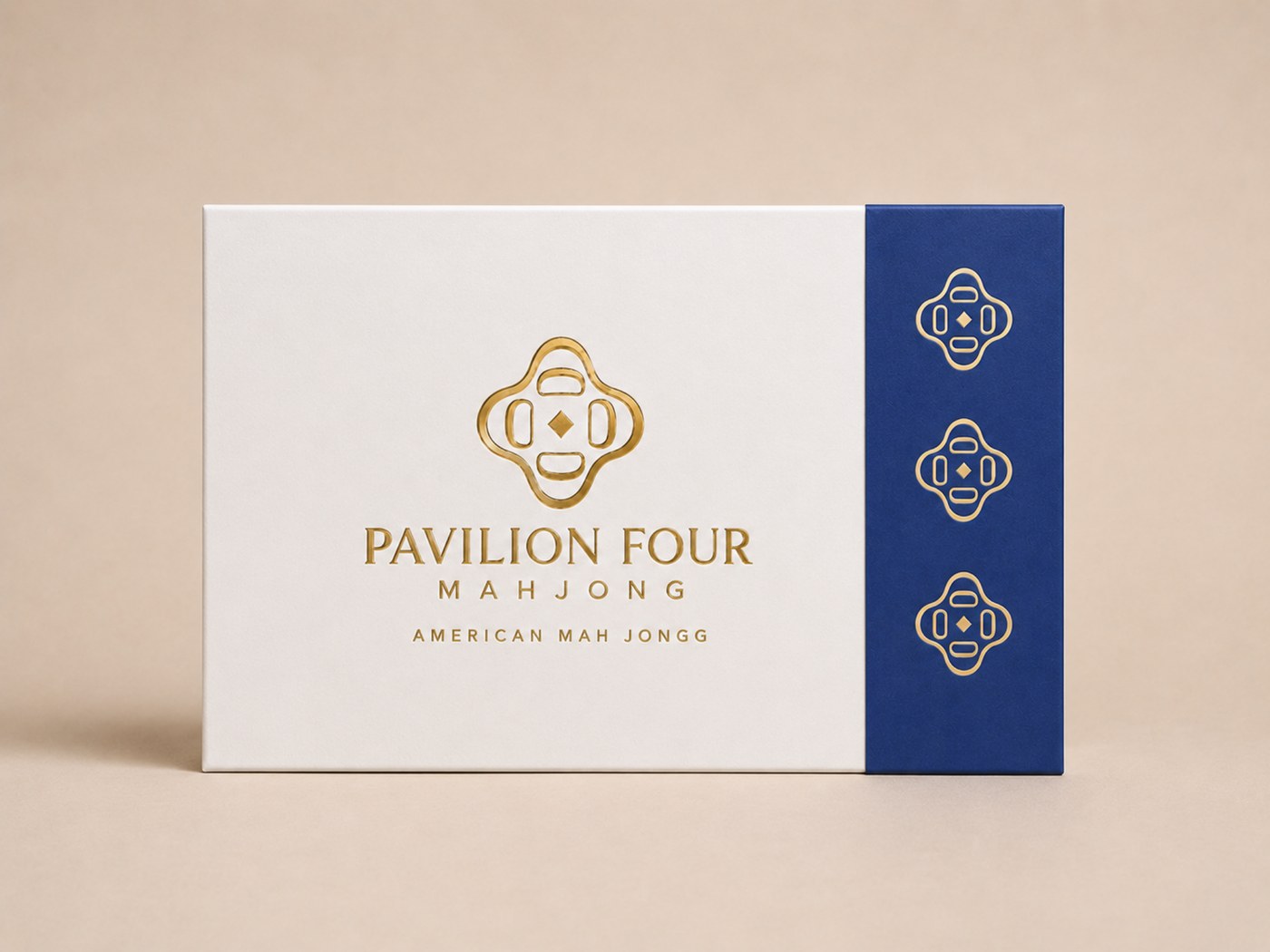 Closed Pavilion Four presentation box with cobalt spine and gold foil logo